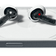 The Nothing Ear (stick) wireless earbuds sitting atop the Nothing (1) smartphone.